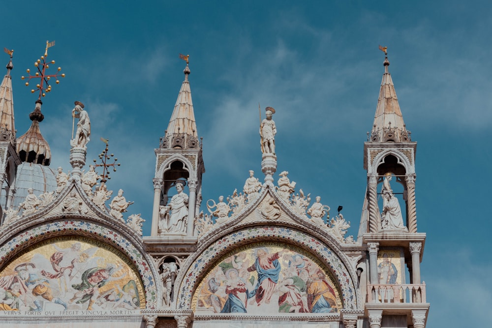 a building with statues on the roof