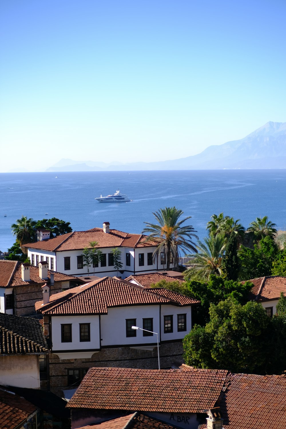 a group of buildings next to a body of water