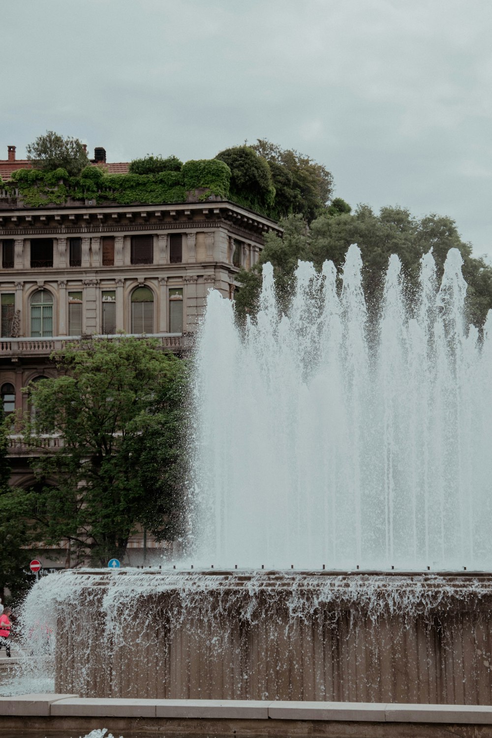 a fountain in front of a building