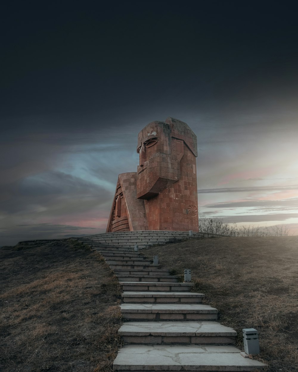 a stone structure on a hill