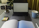 A calm workspace with organized documents and a laptop, showing administrative tasks being managed.