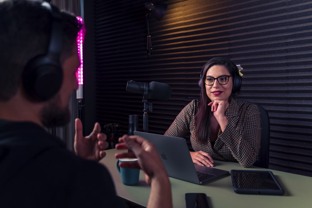 a woman talking to a man