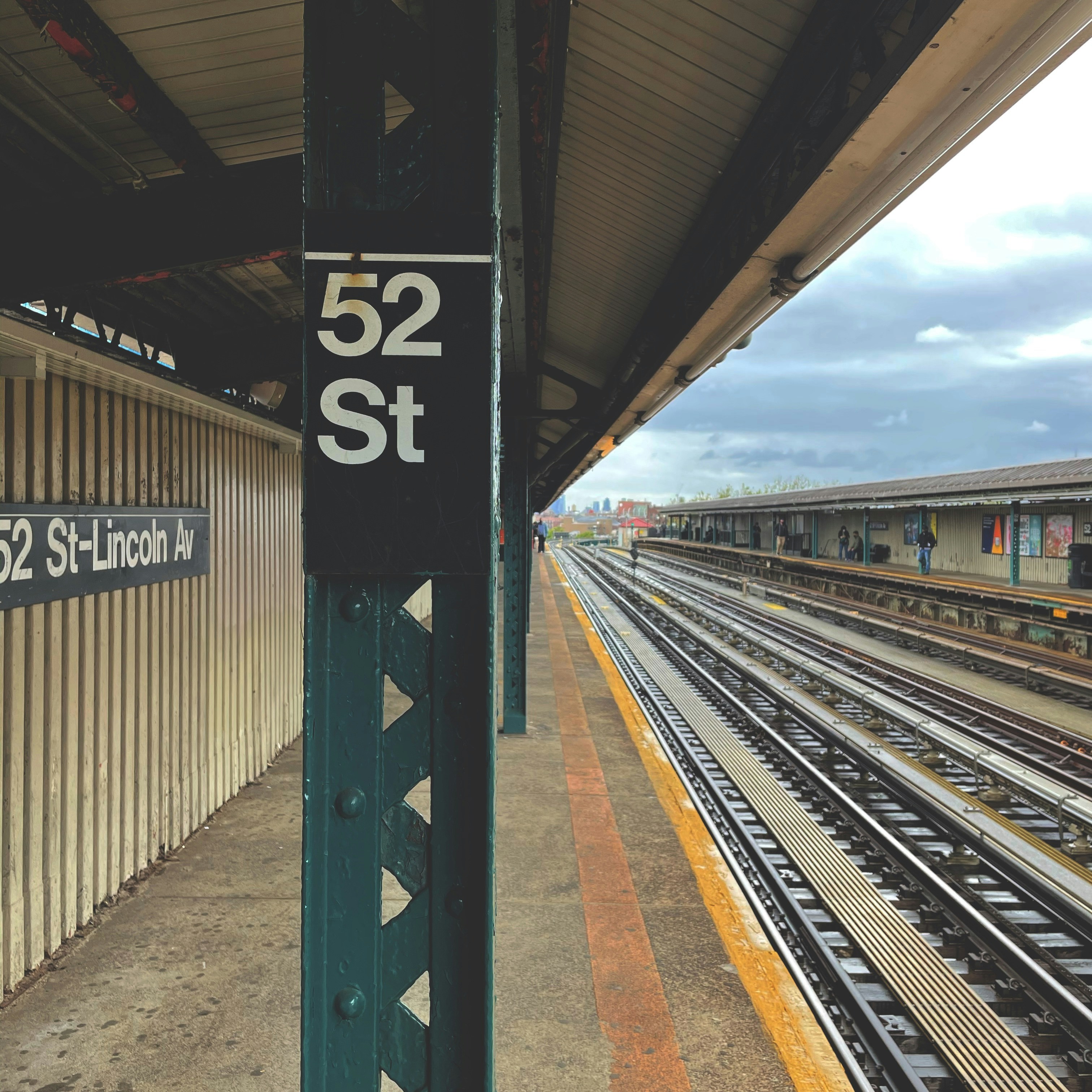 a train station with a sign