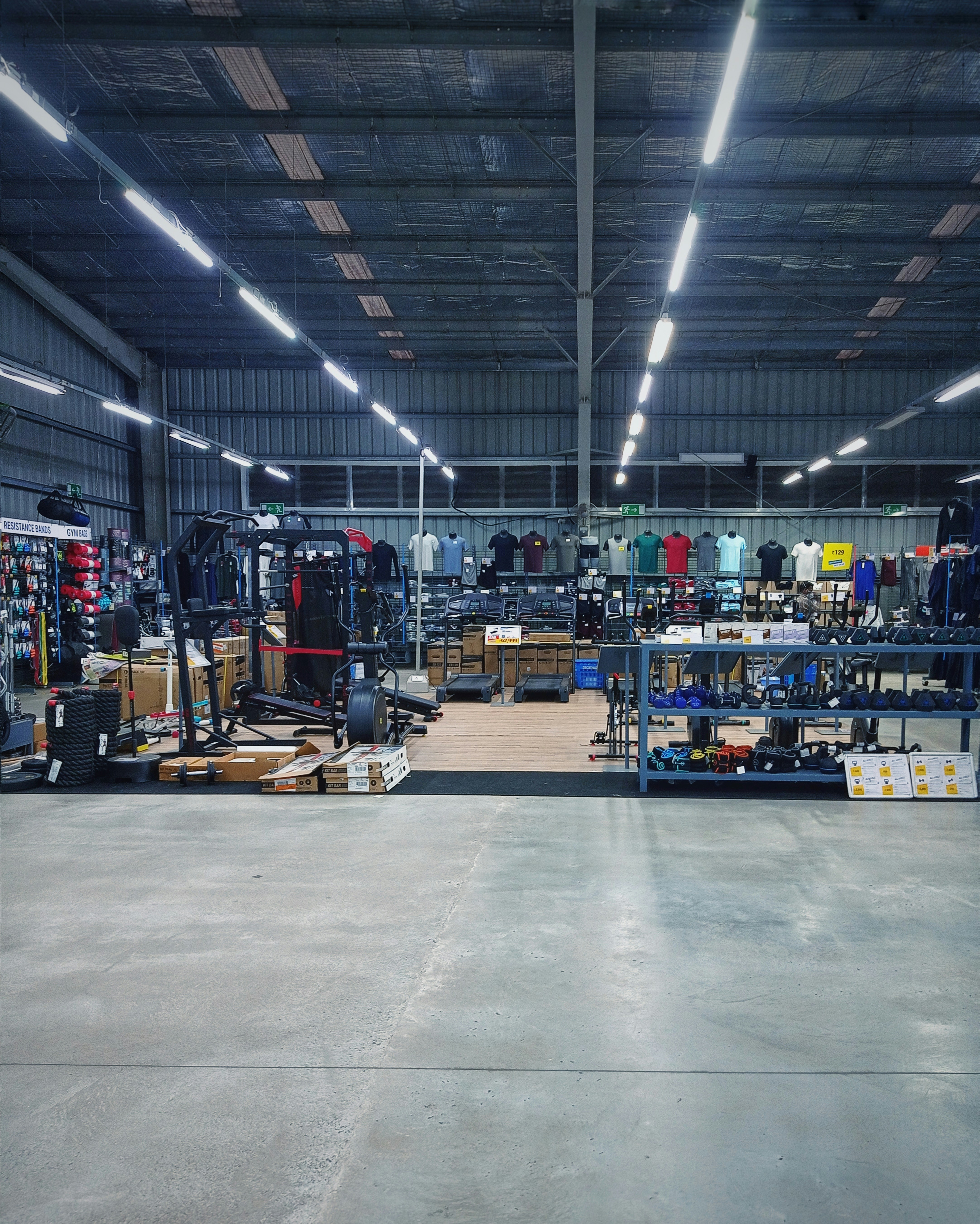 Sports equipment store with gym gear, bright lighting, and athletic apparel on display