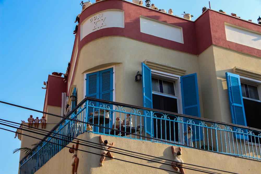 a building with people on the balcony