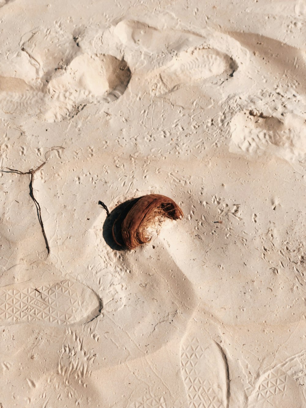 a person lying in the sand