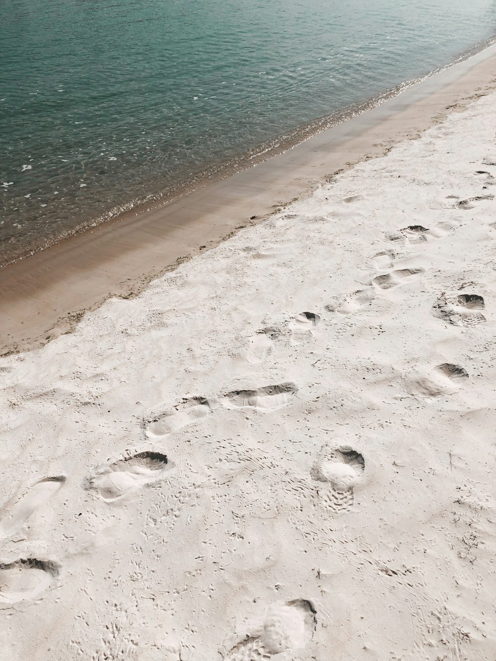a beach with footprints