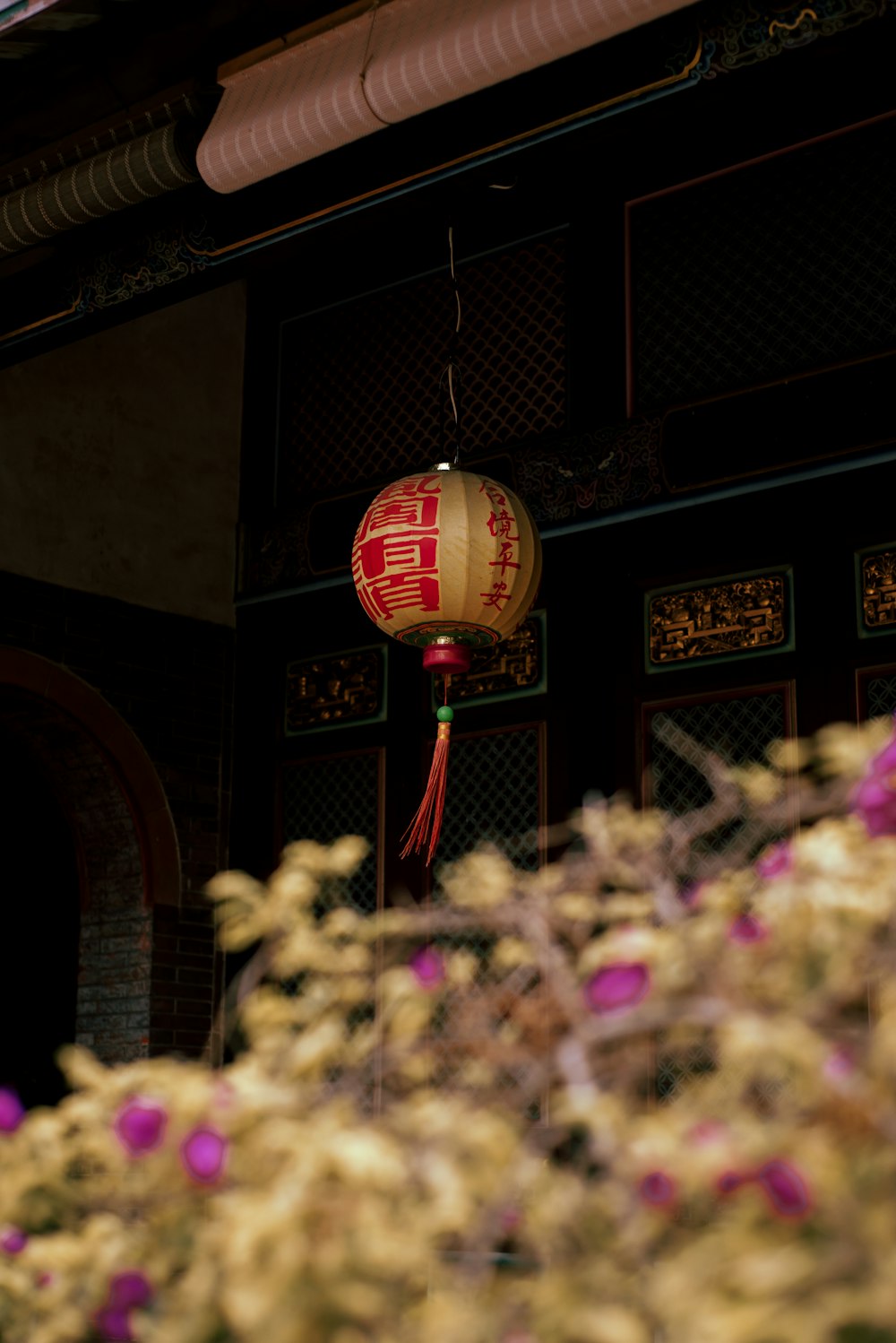 a large clock hangs from a building