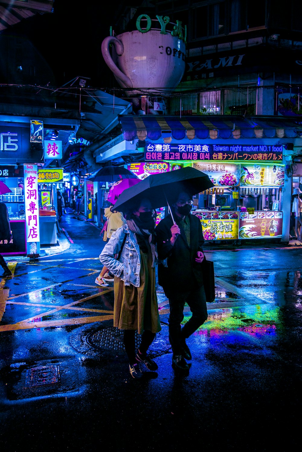 a couple walking in the rain with an umbrella