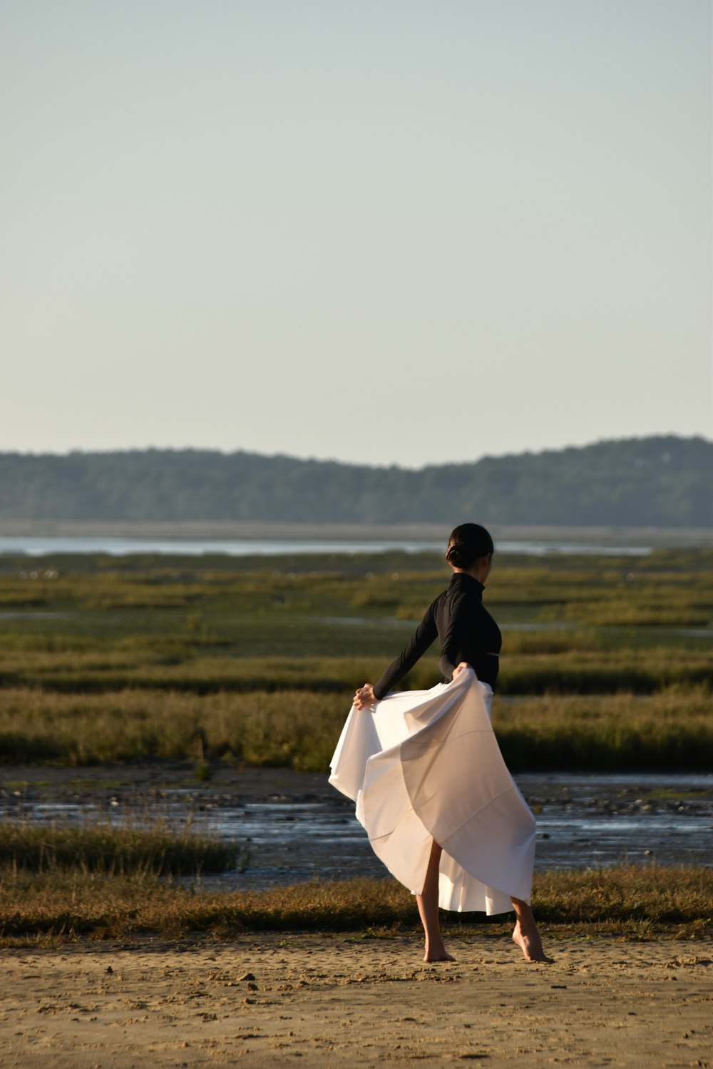 a man and woman walking on a beach