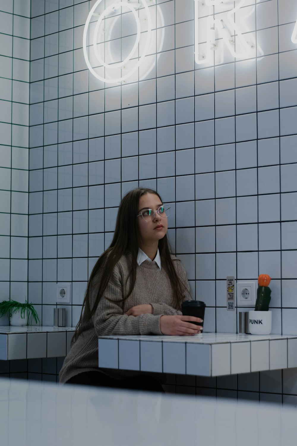 a woman sitting at a counter