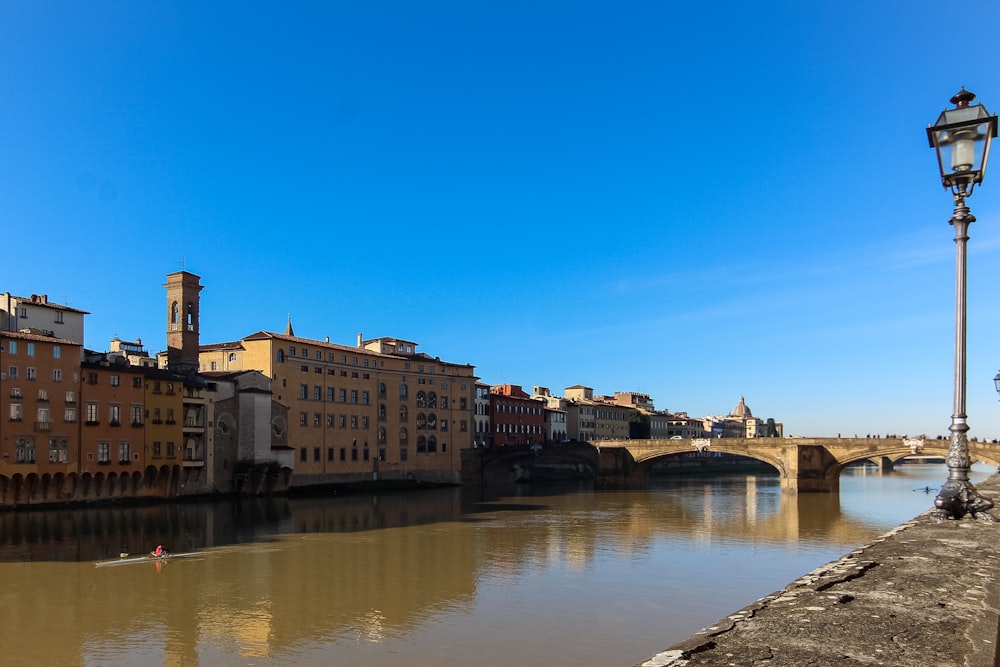 a bridge over a river with buildings on either side of it