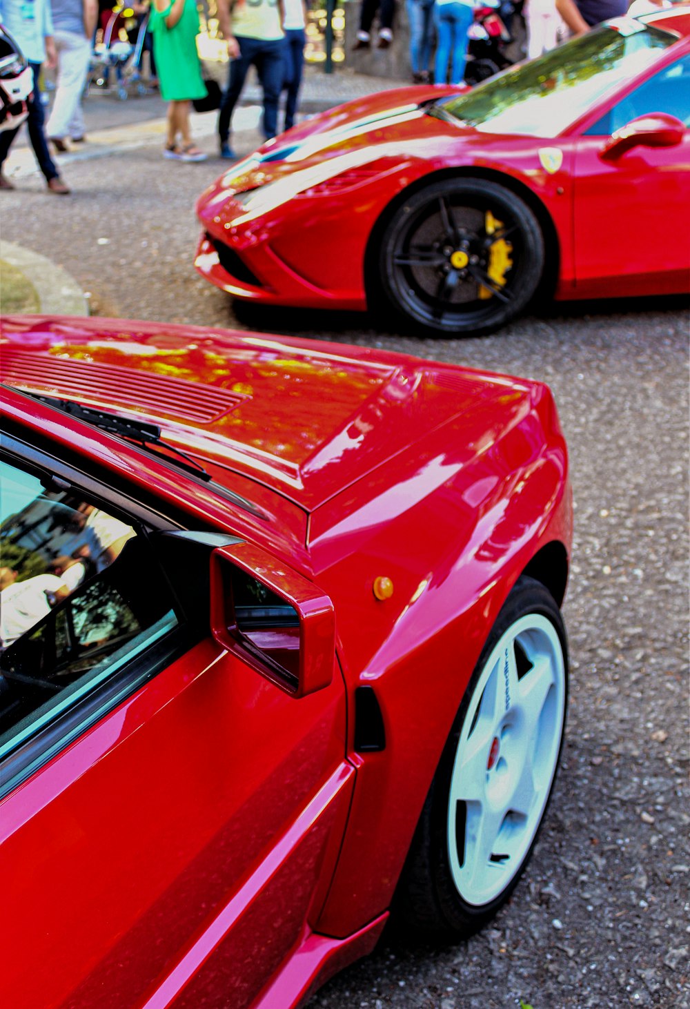 a red car parked next to a red car