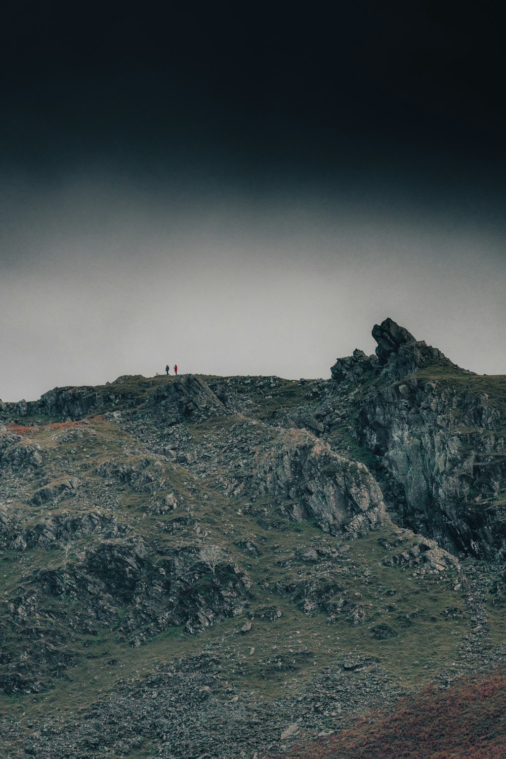 a rocky mountain with a red light