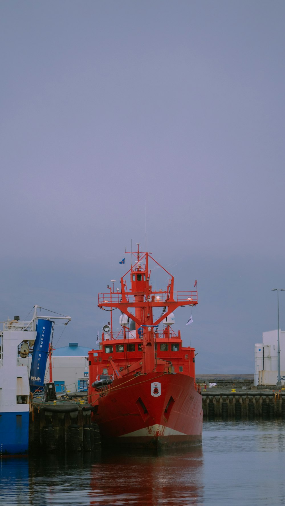 a red boat in the water