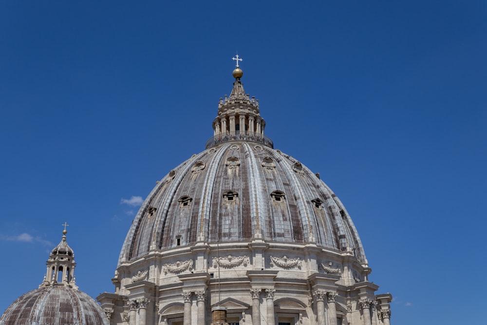 a domed building with a cross on top