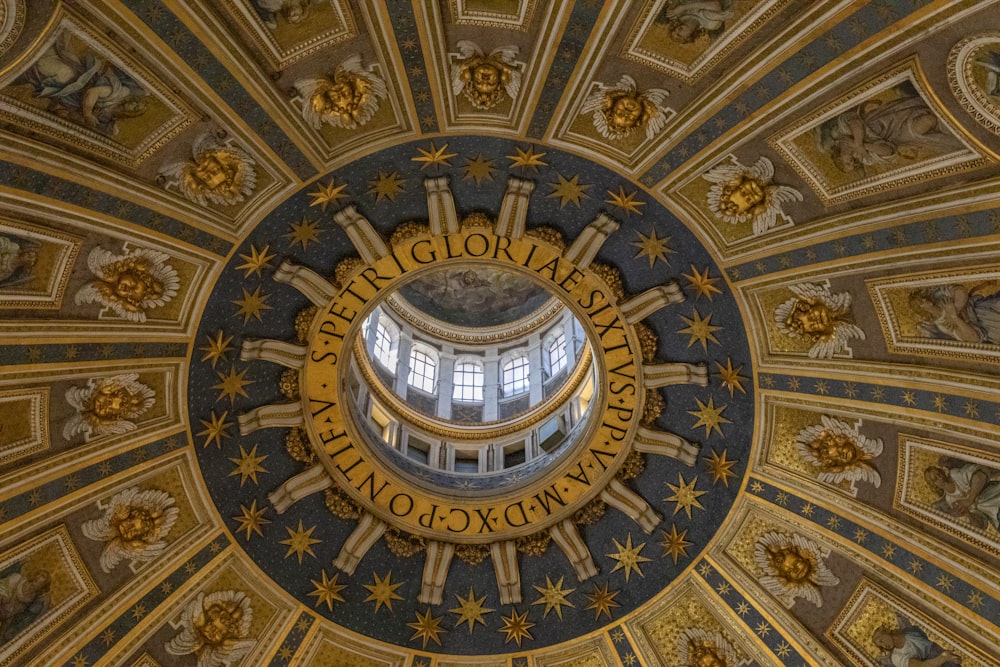 a domed ceiling with a gold design