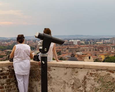a person looking at a telescope