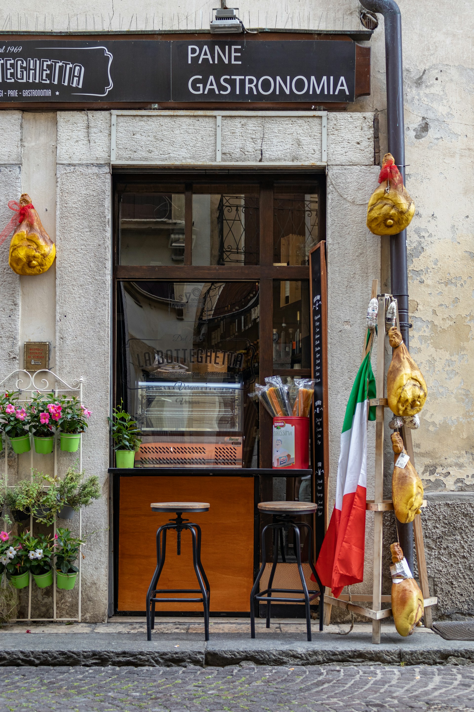 a store front with a black sign
