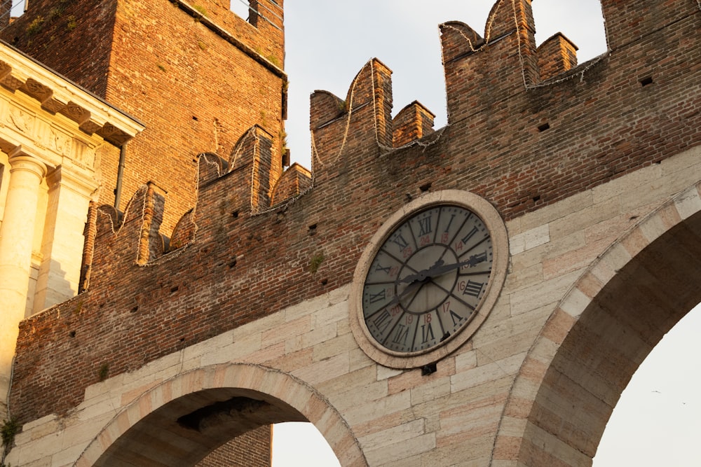 a clock on a brick building