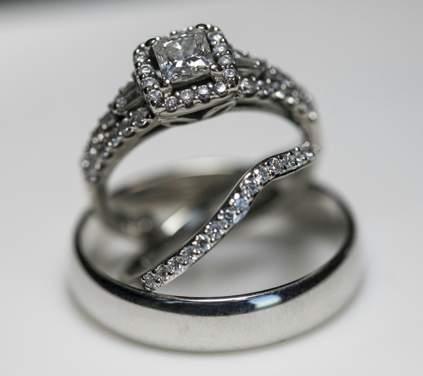 Estelle halo alongside a wedding band