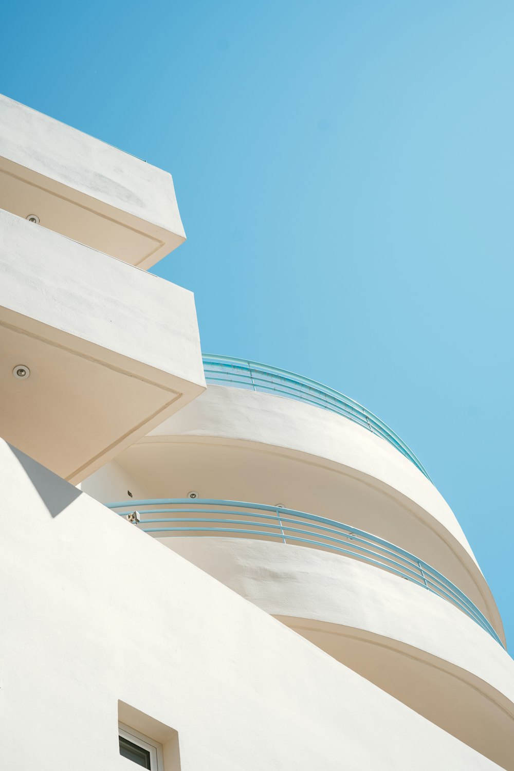 a white building with a blue sky