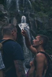 a man pointing at another man