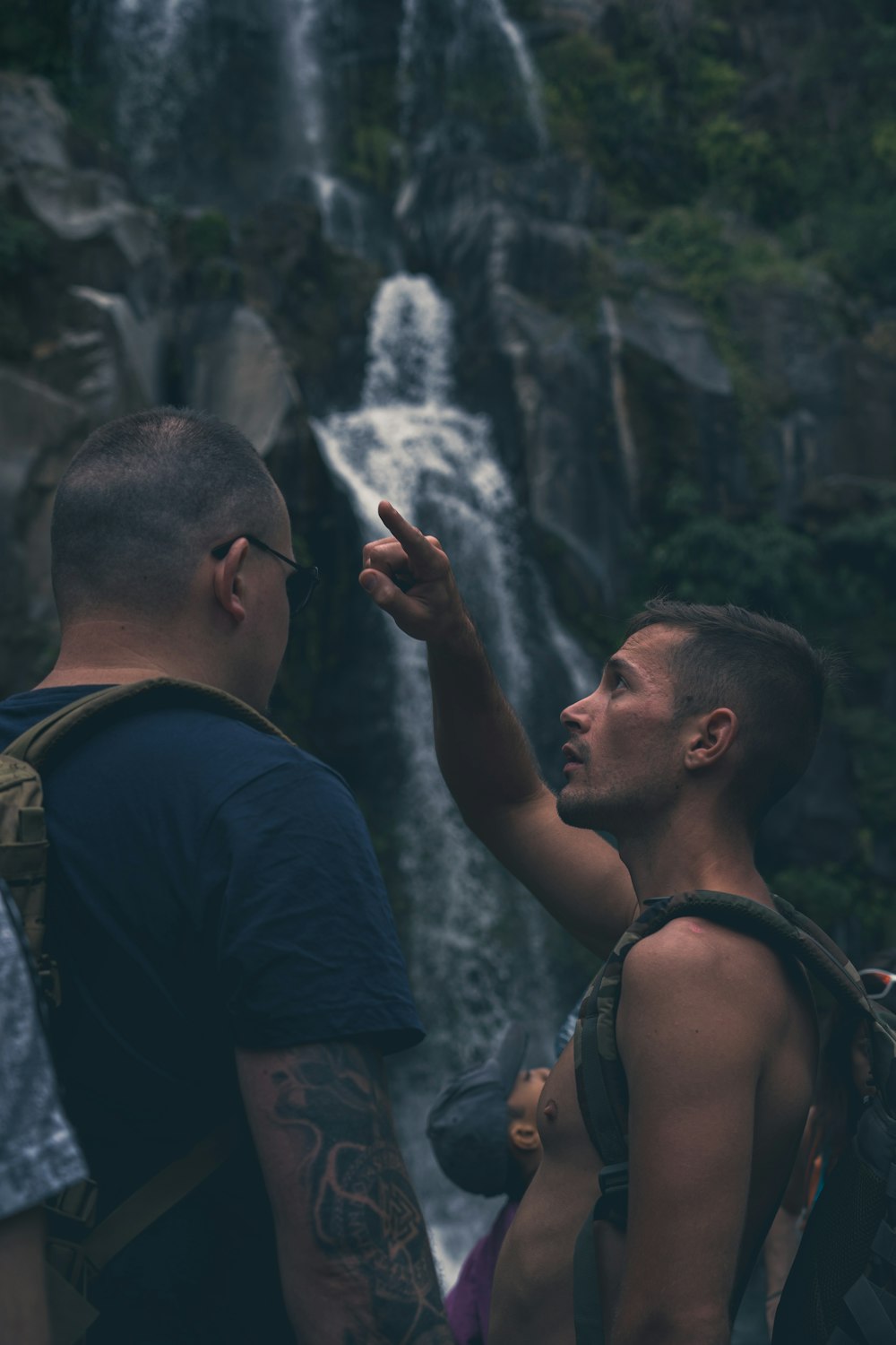 a man pointing at another man