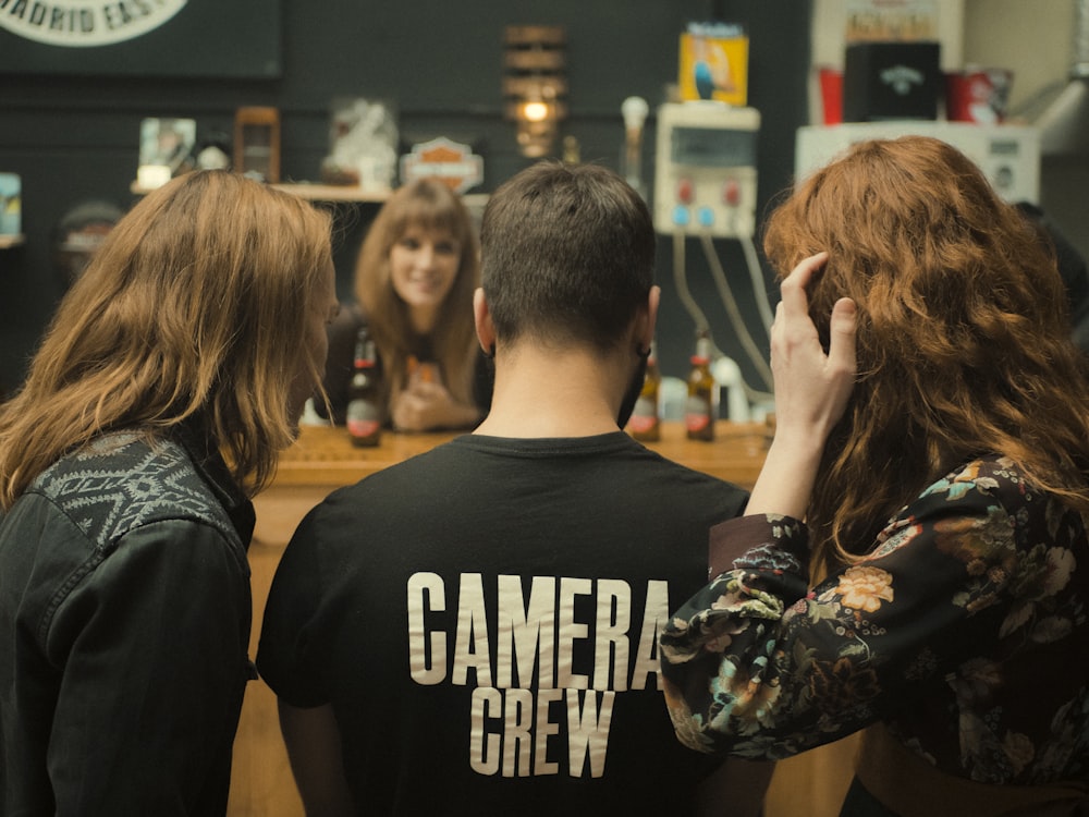 a group of people sitting at a bar