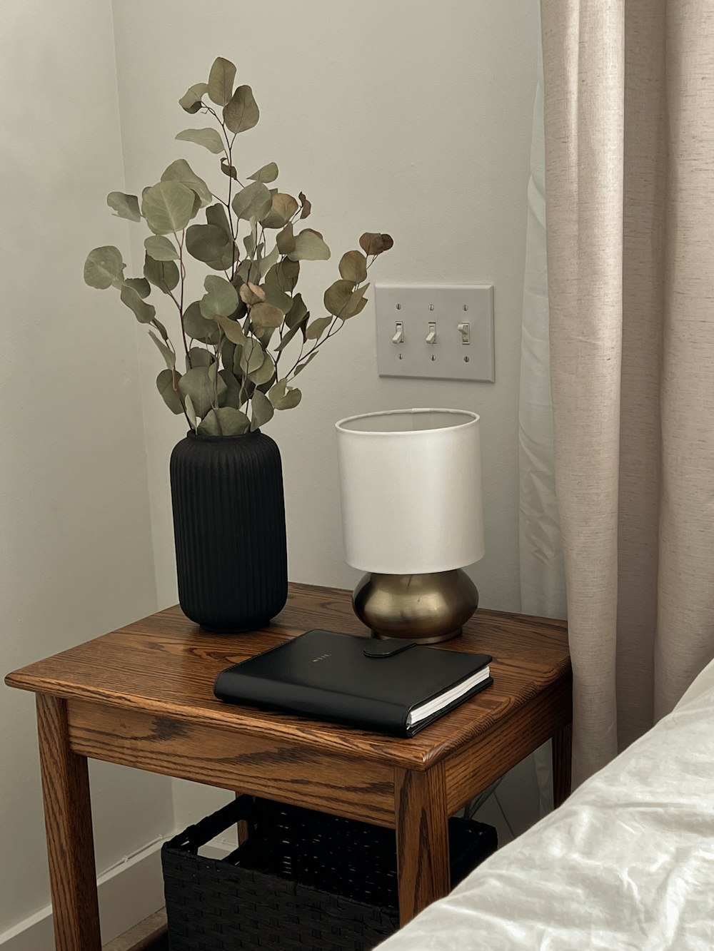 a vase with flowers on a table