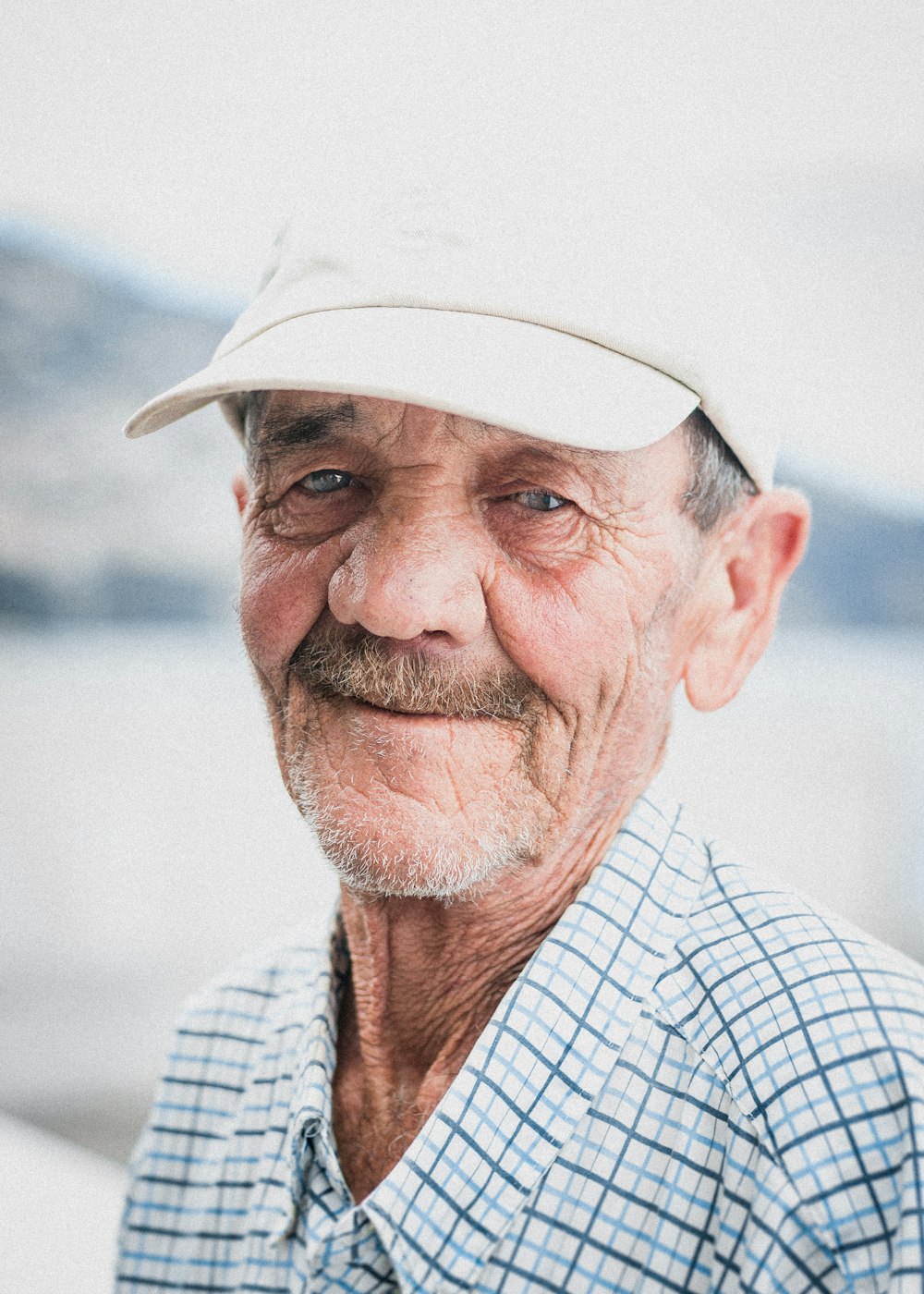 a man wearing a white hat