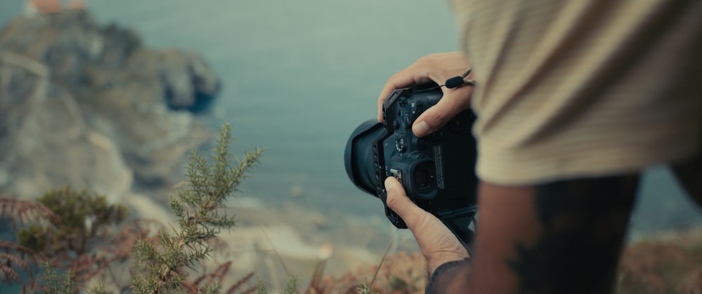 a person holding a camera