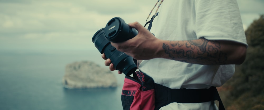 a man wearing a helmet and holding a camera