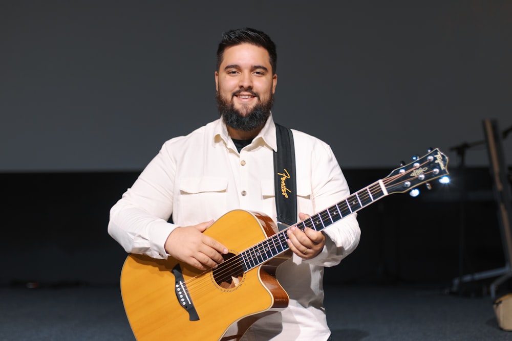 a man holding a guitar