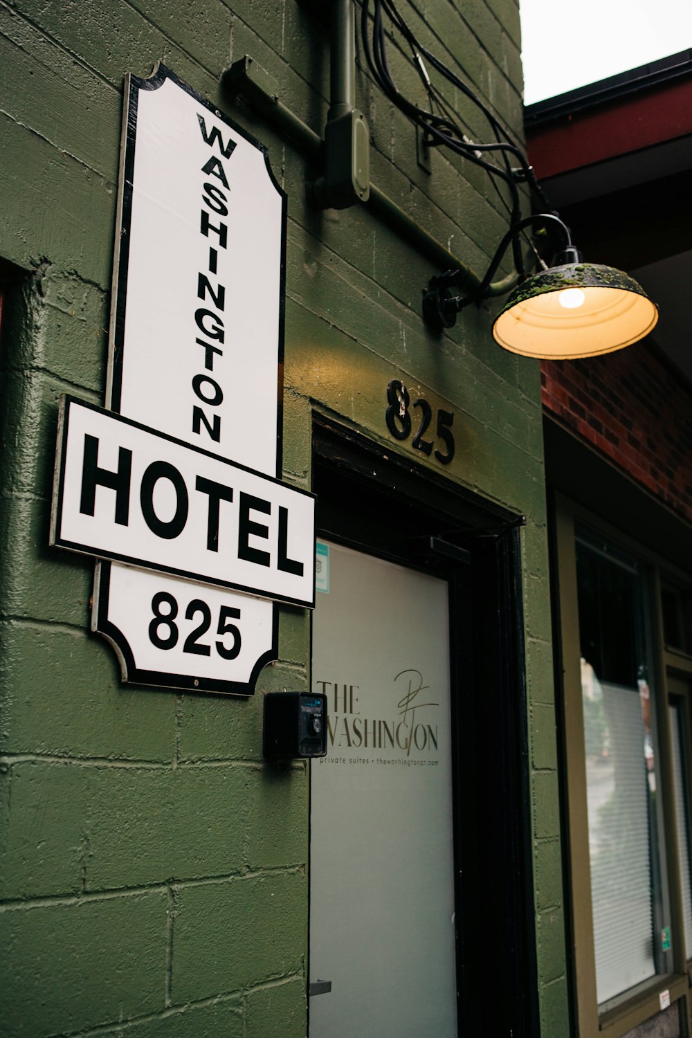 a street sign hangs from a building