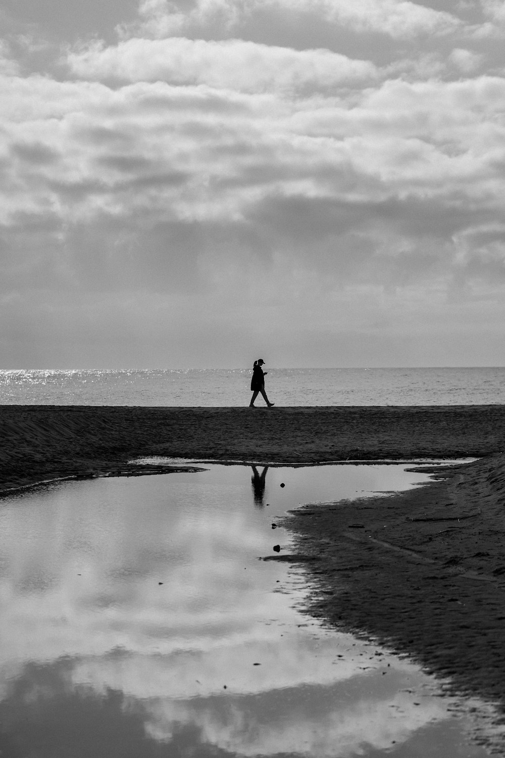 a person walking on a beach