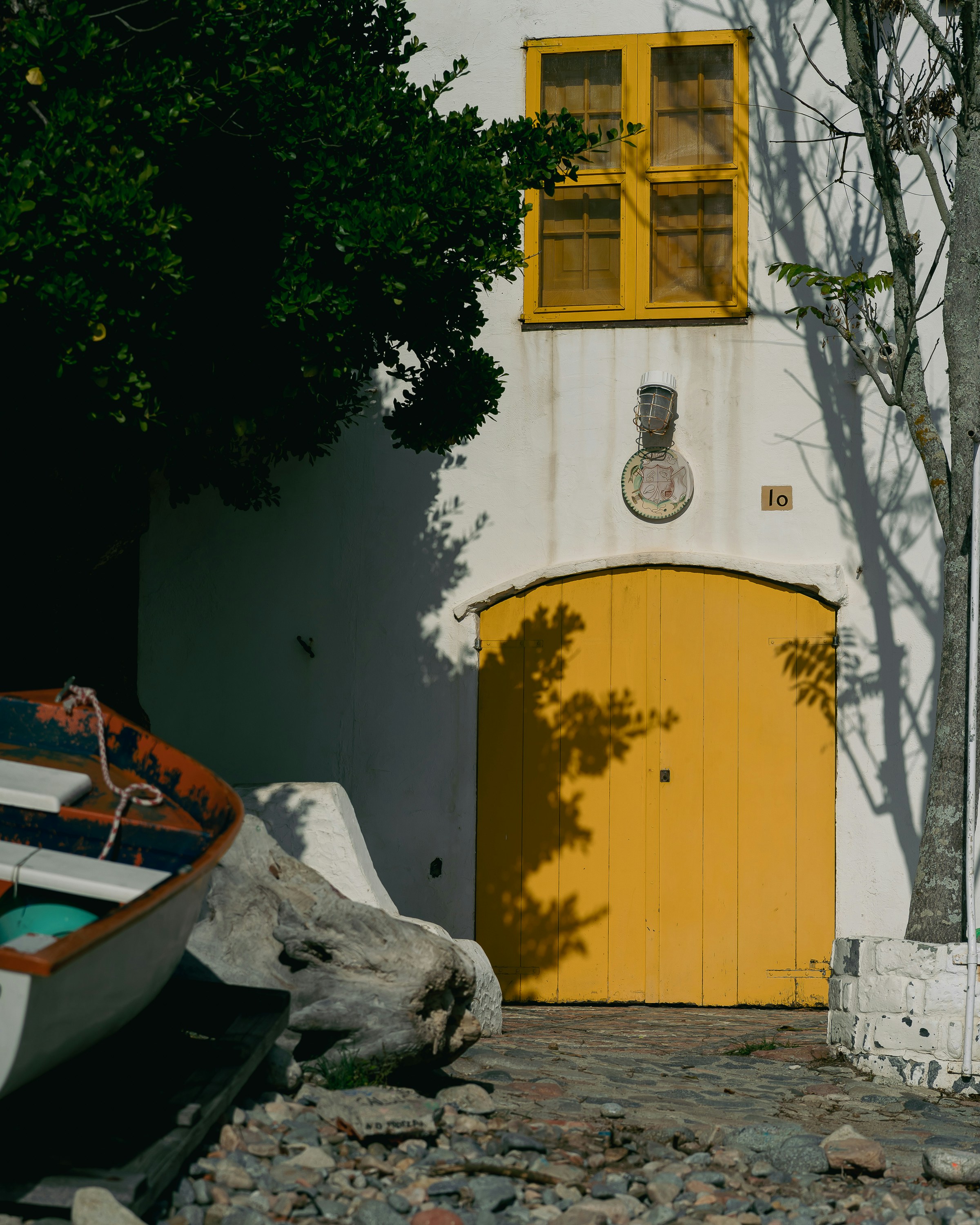 a yellow door next to a boat