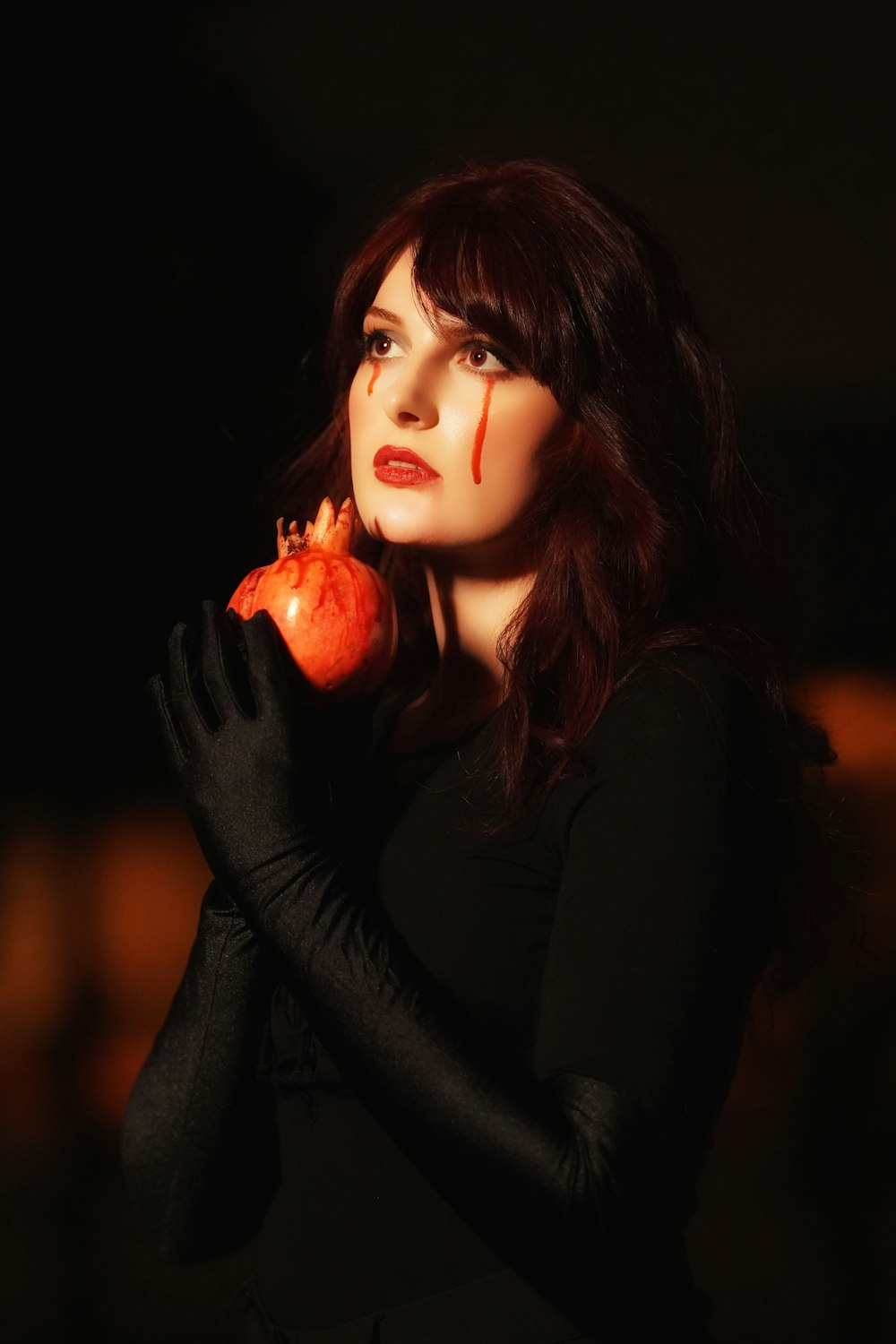 a woman holding an apple