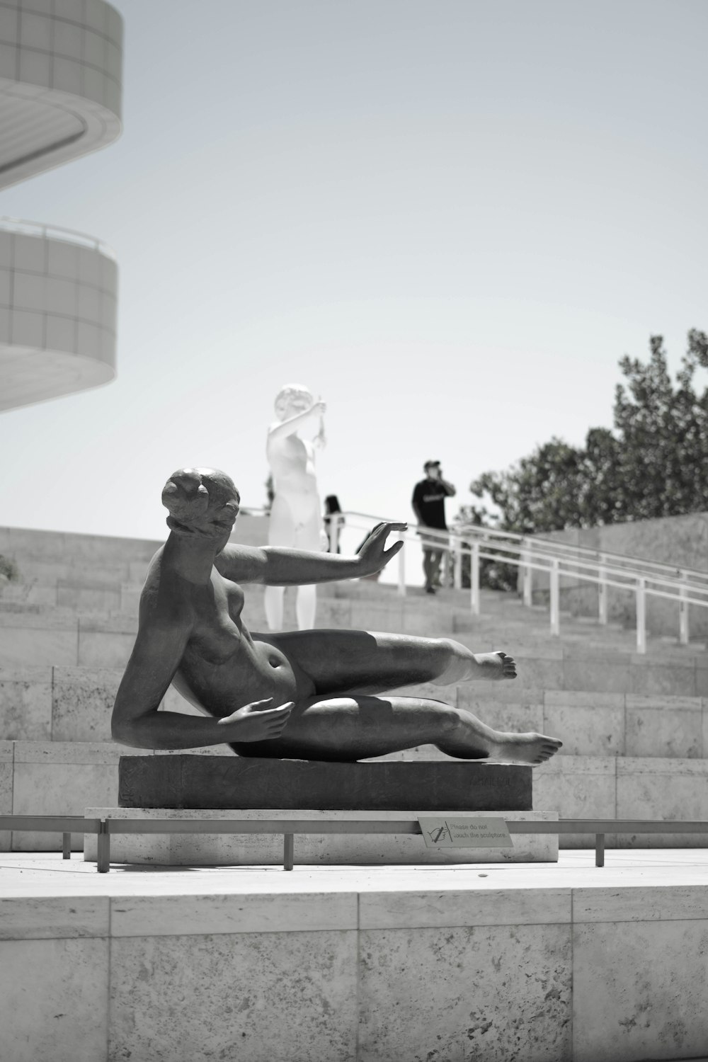 a statue of a person holding a person's hand