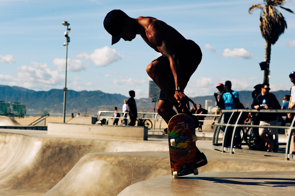 a man doing a trick on a skateboard at a skate park