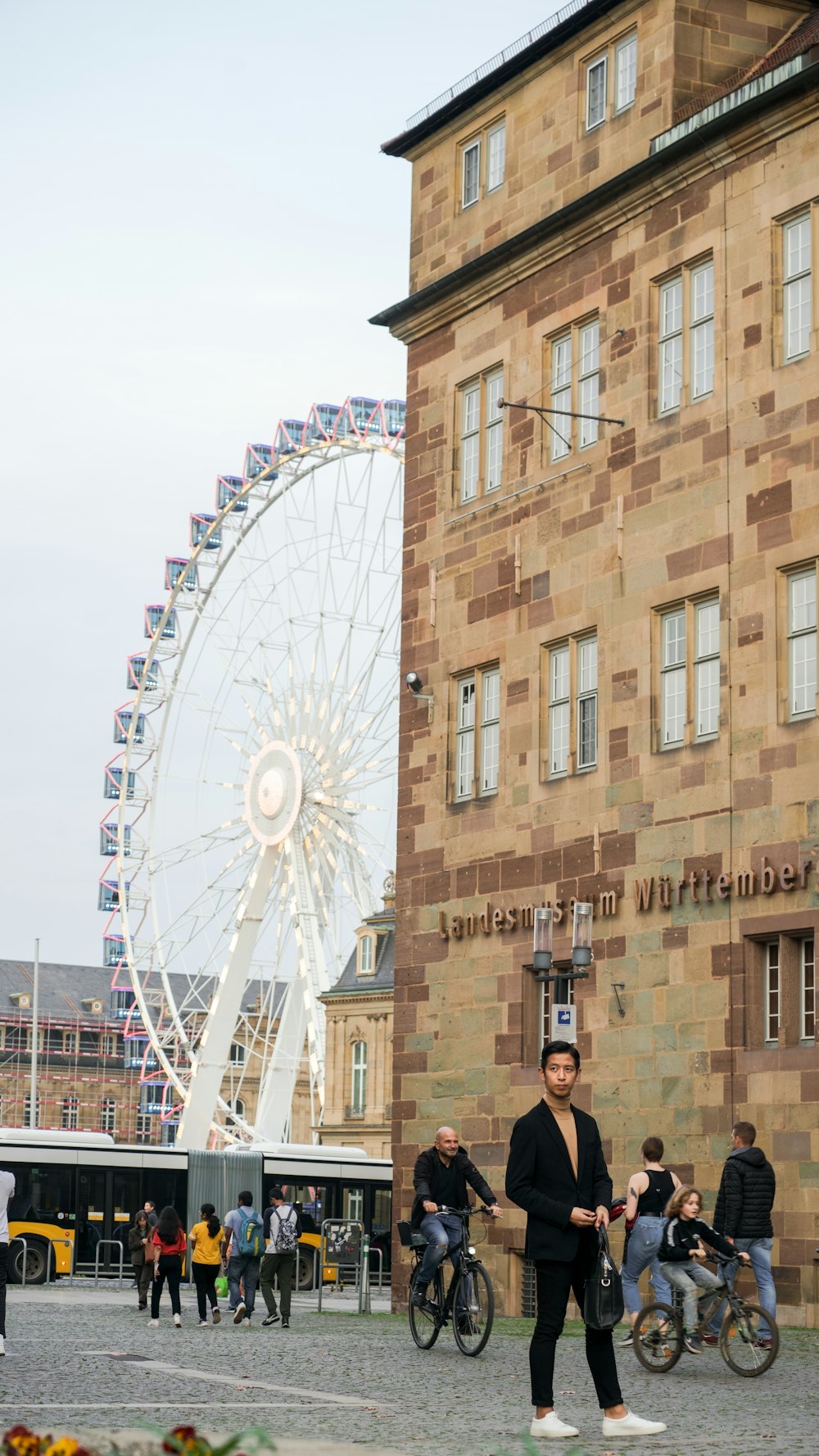 a ferris wheel next to a building