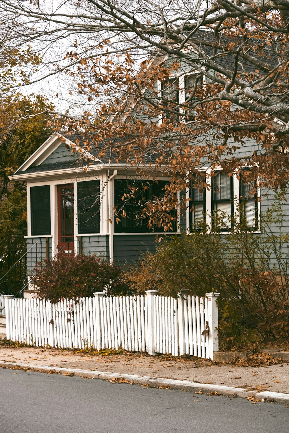 a house with a white picket fence