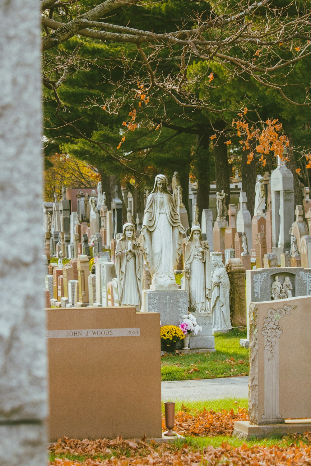 a group of statues in a cemetery