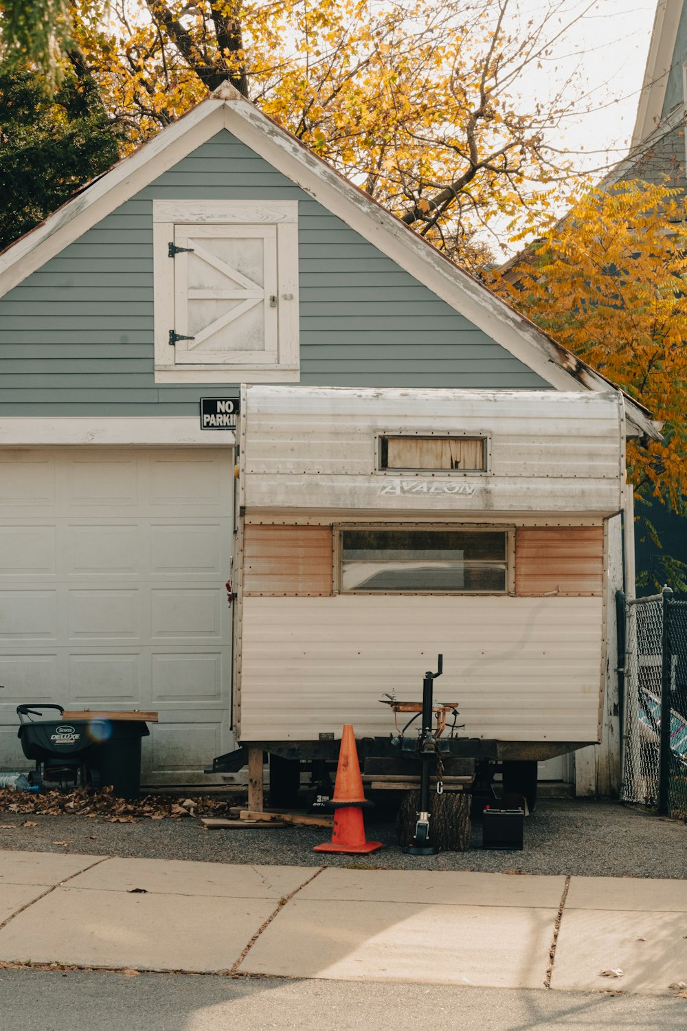 a garage with a cone in front of it