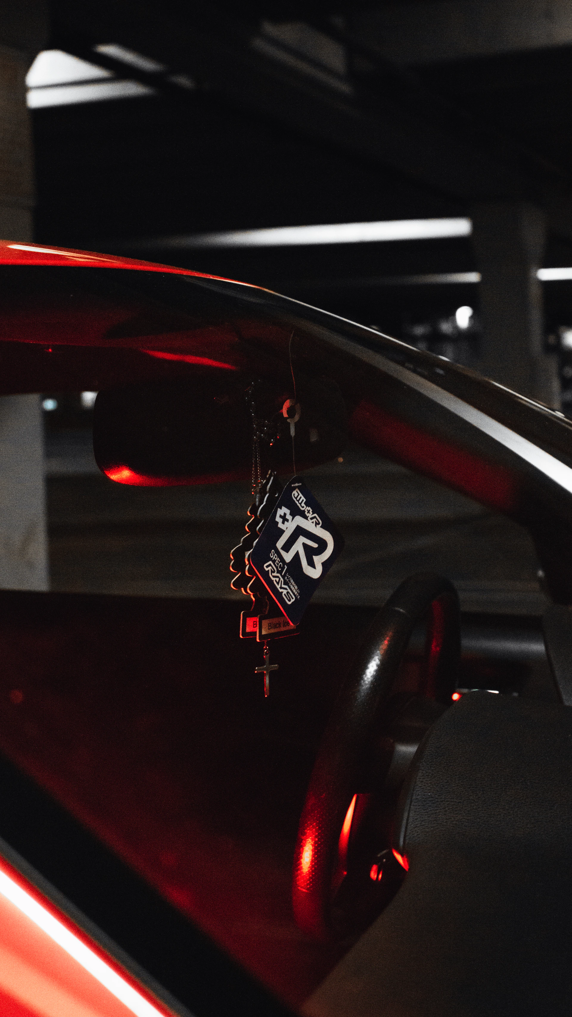 a red car with a black and white logo