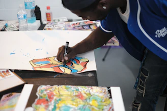 a person painting on a table