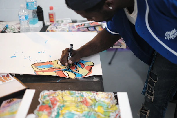 a person painting on a table