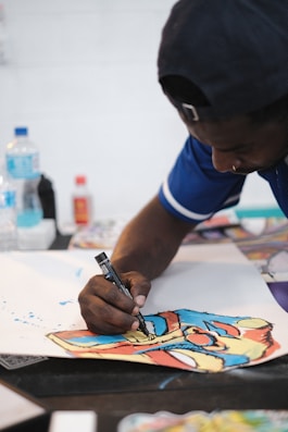 a man writing on a piece of paper