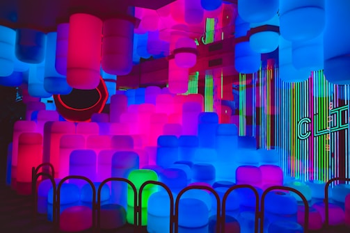 A dynamic scene from a VR game featuring glowing neon elements and sleek minimal design.