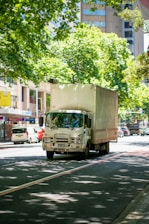 a truck driving down a street